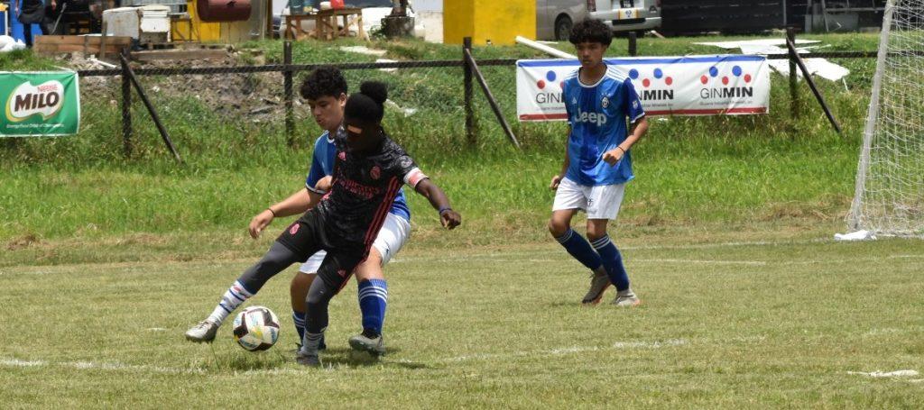 Part of the action in the opening match between East Ruimveldt and Marian Academy, at the Ministry of Education Ground.