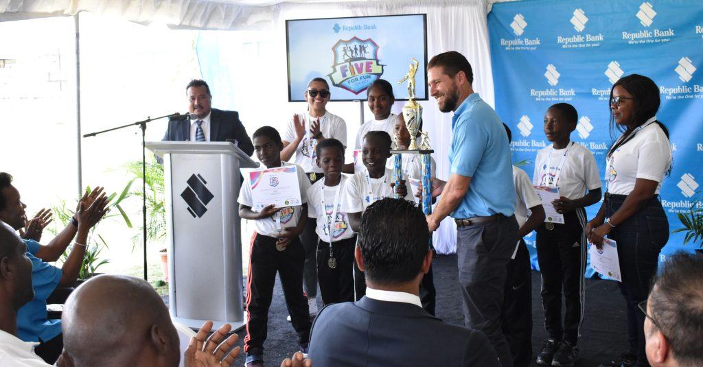 All Saints Primary receives the first place trophy from RBL's Managing Director, Stephen Grell.