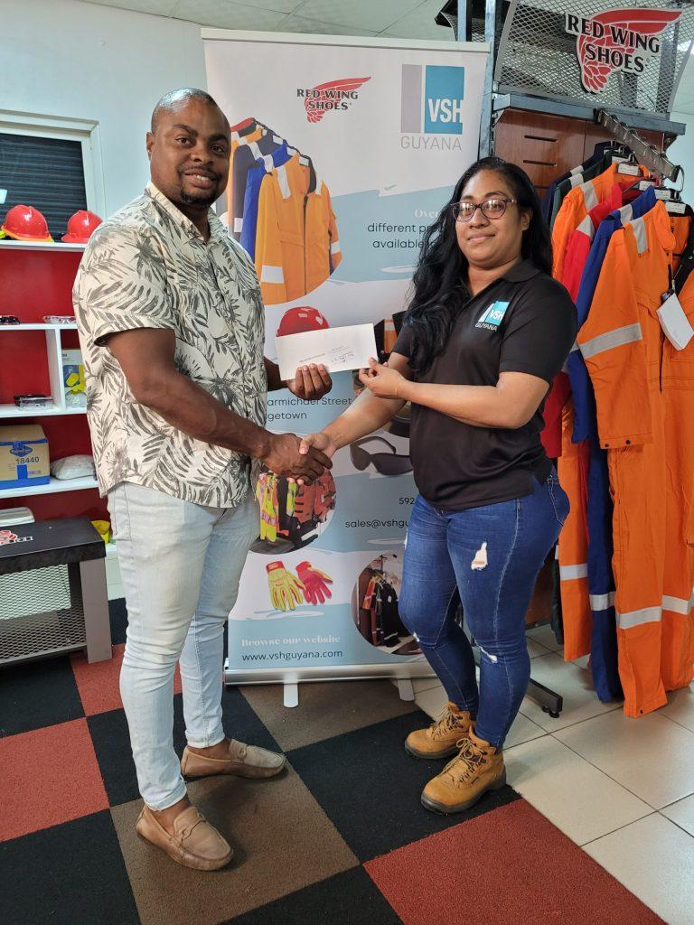 Garment Customisation Lead, Steffanie DeAbreu (right), handed over the sponsorship to Edison Jefford at VSH United, Carmicheal Street.