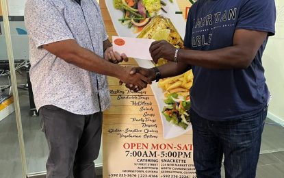 One Guyana Futsal Championship cooking with Maggie’s catering services