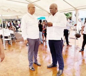 Minister of Public Works, Juan Edghill and Prime Minister, Mark Phillips in Region Eight on Tuesday who attended the funerals of the three girls who perished in the Mahdia fire. (Photo courtesy, Minister of Public Works, Juan Edghill)