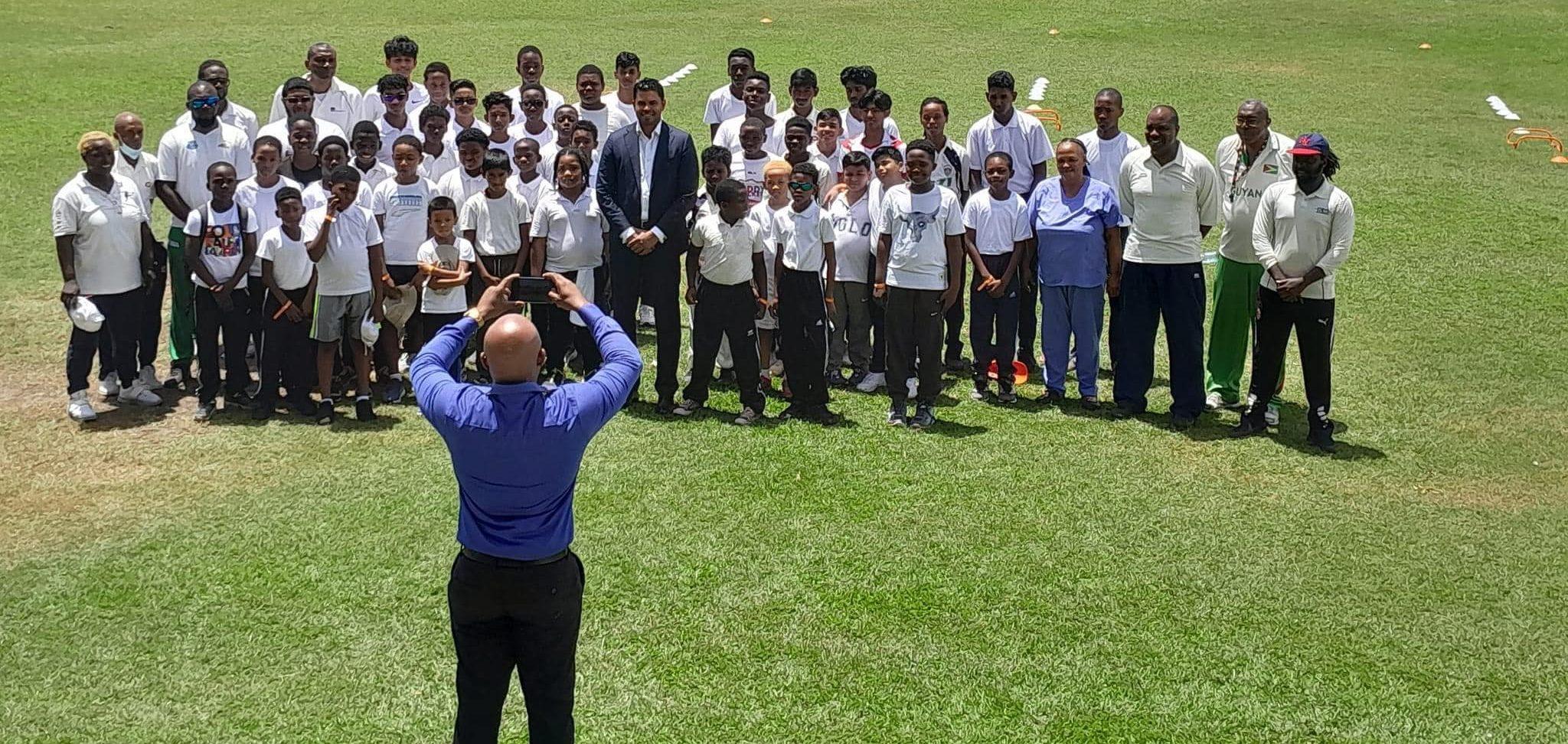 The group of youngsters share photo with Minister Charles Ramson (center) and other support staffs on opening day.