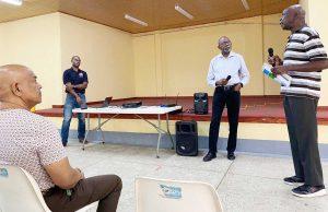 A citizen (right) shares his concern about the lack of public engagements on oil and gas matters during an ExxonMobil consultation in February this year at Mahaica.