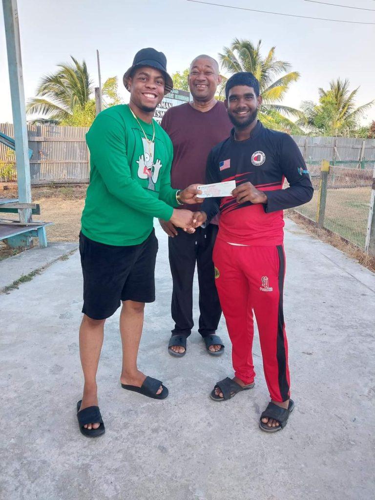 Berbice Under 17 Captain receives the sponsorship from Shimron Hetymer in the presence of BCB President Hilbert Foster.