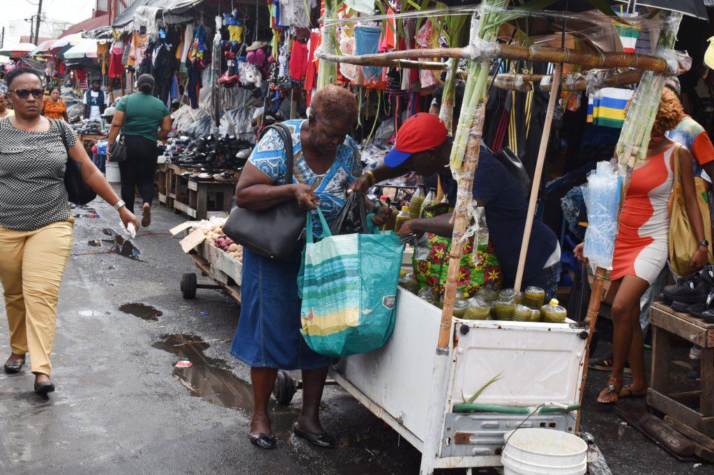 This elderly woman was seen stocking up on very cold cane juice to brave the heat yesterday. The male vendor was excited at her large purchase