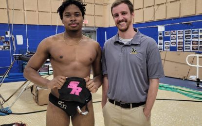 Swimmer, Delroy Tyrrell, wins three gold and High Point Trophy for College of Saint Rose