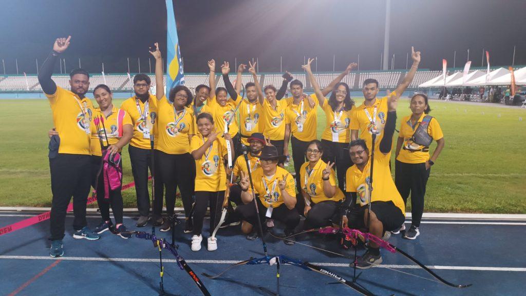 Guyanese Archers celebrate with their medals at the championship.