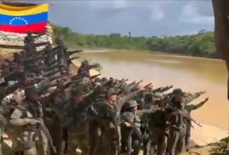 Screen grab of video recorded of Venezuelan soldiers at Anacoco Island pointing their hands towards Guyana’s territory while saying, “The sun of Venezuela rises in the Essequibo”.