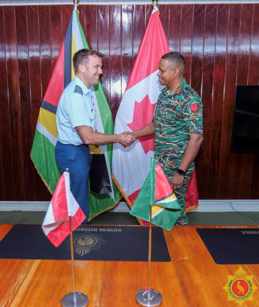 Chief-of-Staff, Brigadier Omar Khan, right and Colonel Marc-Antoine Fecteau, Canadian Non-Resident Military Attaché to Guyana and Brazil during a meeting at Defence Headquarters.