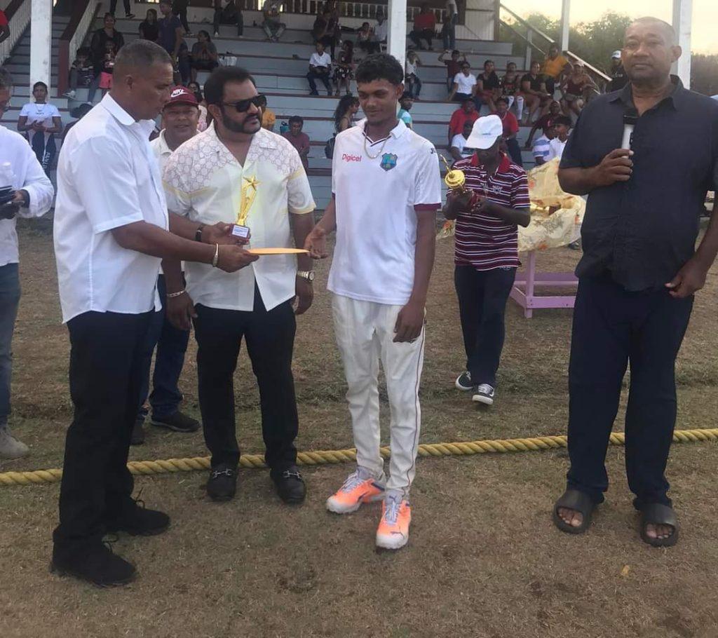 Man of the finals Charran Singh receives his award from you UCCA president Dennis D’Andrade.