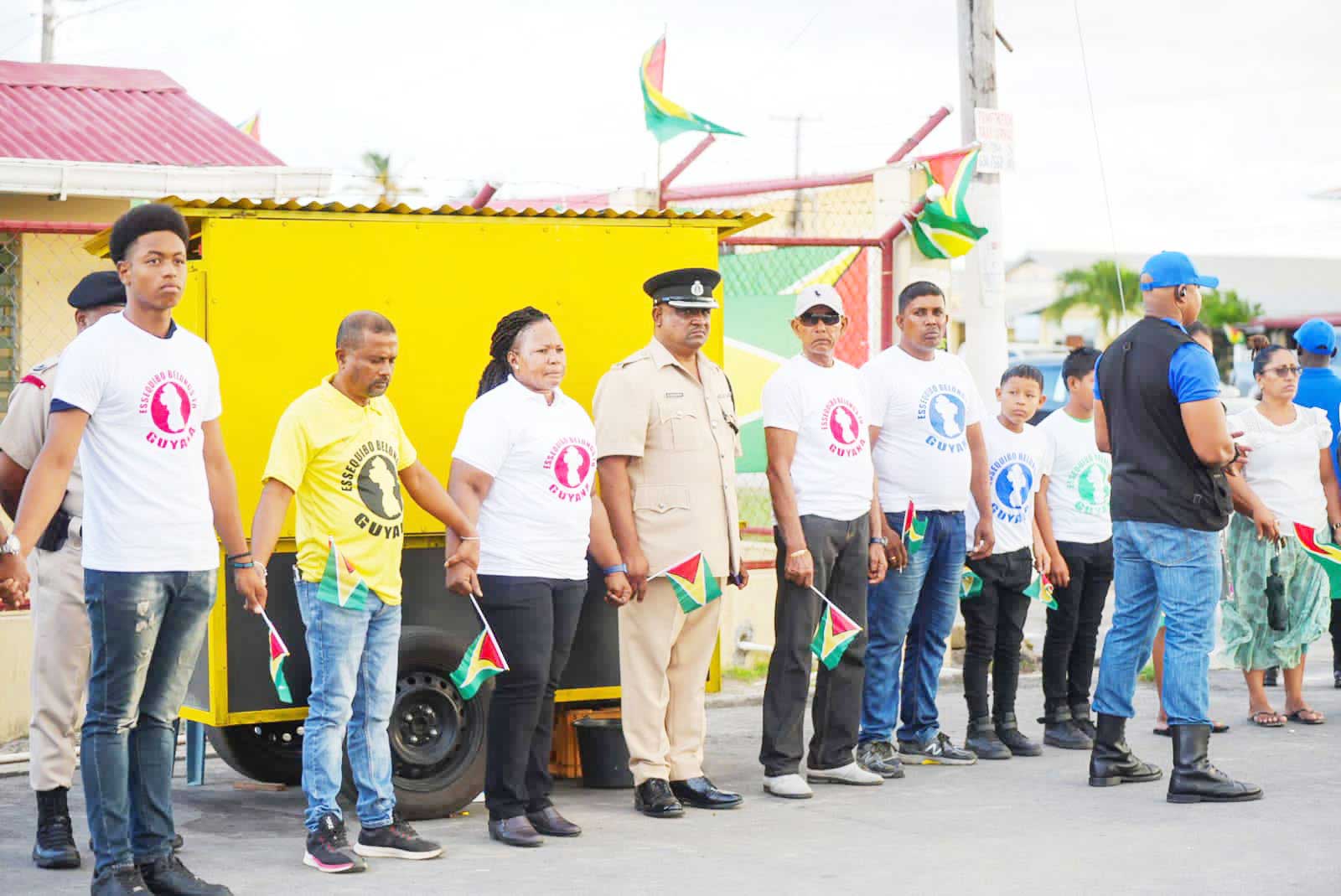 Residents of the Essequibo Coast during the circle of unity exercise on Sunday