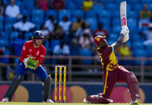 Rovman Powell launches one during his 39 (Associated Press)