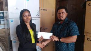 Ariana Singh of Ink Plus presents the sponsorship package to Divendra Bhishan