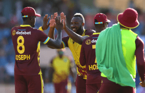 Andre Russell celebrates the wicket of Jos Buttler (Associated Press)