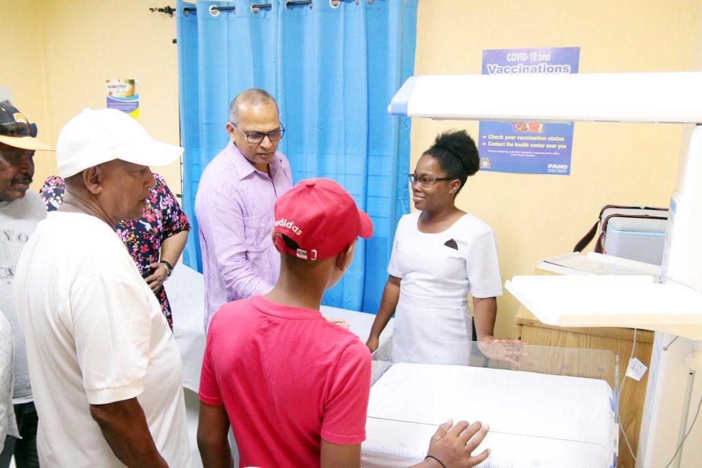 Minister of Health, Dr. Frank Anthony during a walk-through of the health post. (Ministry of Health photos)