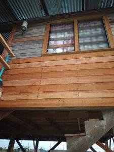 Damaged window frames on the family’s home