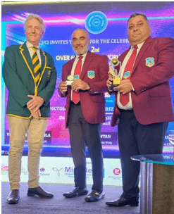 Manager Raj Singh & Captain Zamin Amin receive their 5th place trophy from Murray Harrison, Chairman of the IMC O60s.