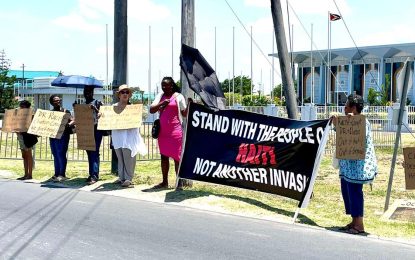 Guyanese protest Bill Clinton’s visit for role played in destabilizing Haiti