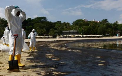 Singapore races to clean-up beaches after oil spill