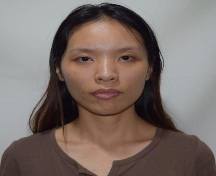 Charged for overstaying her time in Guyana, Zhong Jin Ziang