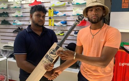 Kascon Engineering donates bat to Rampertab Ramnauth