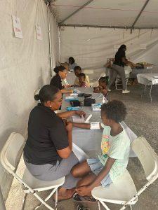 Adults and children of ‘Tiger Bay’ community at the philanthropy project