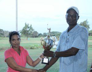 Mohanlall Dindanauth (right) receives his prize.