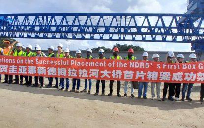 First precast girder installed at new Demerara River Bridge