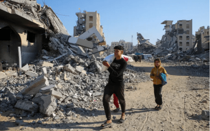 Israel continues to pound Gaza, issue new evacuation threats