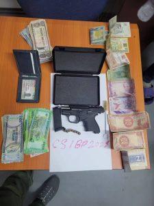 Duo nabbed with illegal gun, ammo, and foreign currency