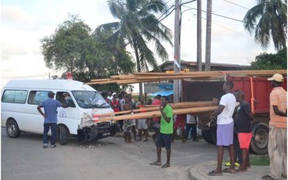 Ambulance with patient crashes into lumber truck