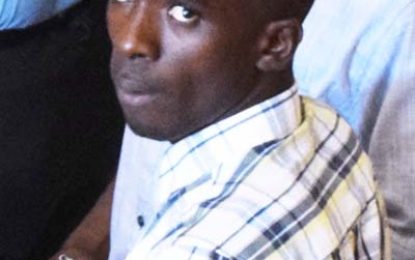 Grove man remanded for shooting at another