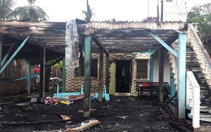 Man threatens wife, then burns house