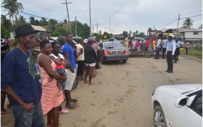West Berbice residents block roadway over flood waters