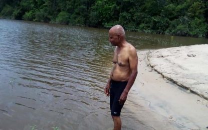 Ashraf ‘River Conqueror’ Ali swims the Essequibo