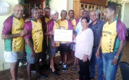 United States-based group hands US$15,000 to Guyanese counterparts