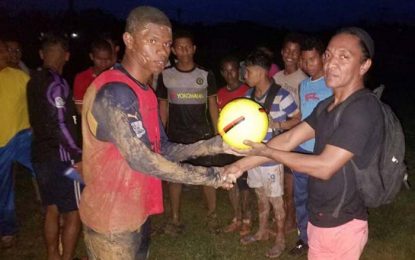 Boyer makes presentation to Port Kaituma Secondary football team