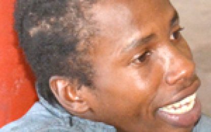 Fugitive surrenders at Brickdam Police Station