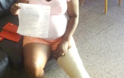 Woman, 51, breaks leg after falling into manhole