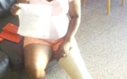Woman, 64, injured after falling into manhole