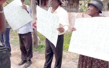 Coalition supporters protest PPP outreach meetings in Berbice