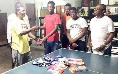 ‘Ashes’ Angel donates groin protectors, mouth guards to Carryll Boxing Gym of Linden