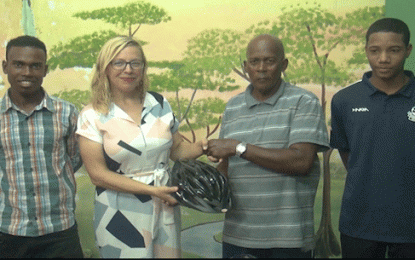 Flying Ace Cycle Club receives racing helmets from US Volunteer group