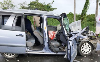 Car runs into truck on the East Bank