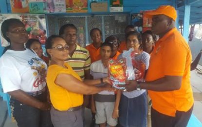 Berbice police make donation to teen whose family was murdered