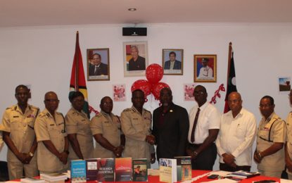 Guyanese Security Expert presents books to the Police Force