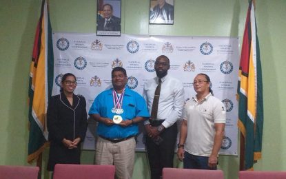Director of Sport bestows gold medal of acknowledgment on Archer Robert Singh