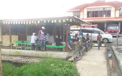 Take a walk City officials…Illegal rum shop and open toilet behind Stabroek cafeteria