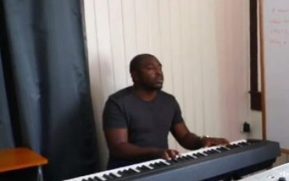 Visually impaired man tops music class