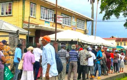 Hundreds of pensioners flock to post offices, despite social distancing pleas